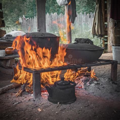 ukraine women cooking outside fire